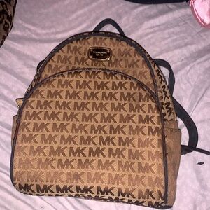 Micheal kors back pack and bag is used